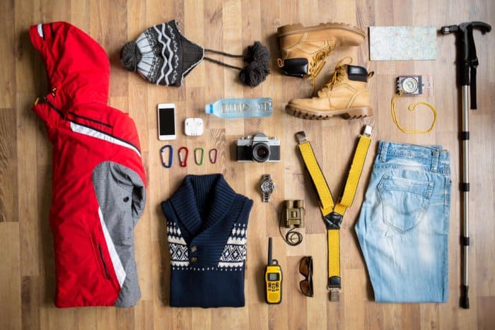 Flatlay of items on summer packing list for Iceland