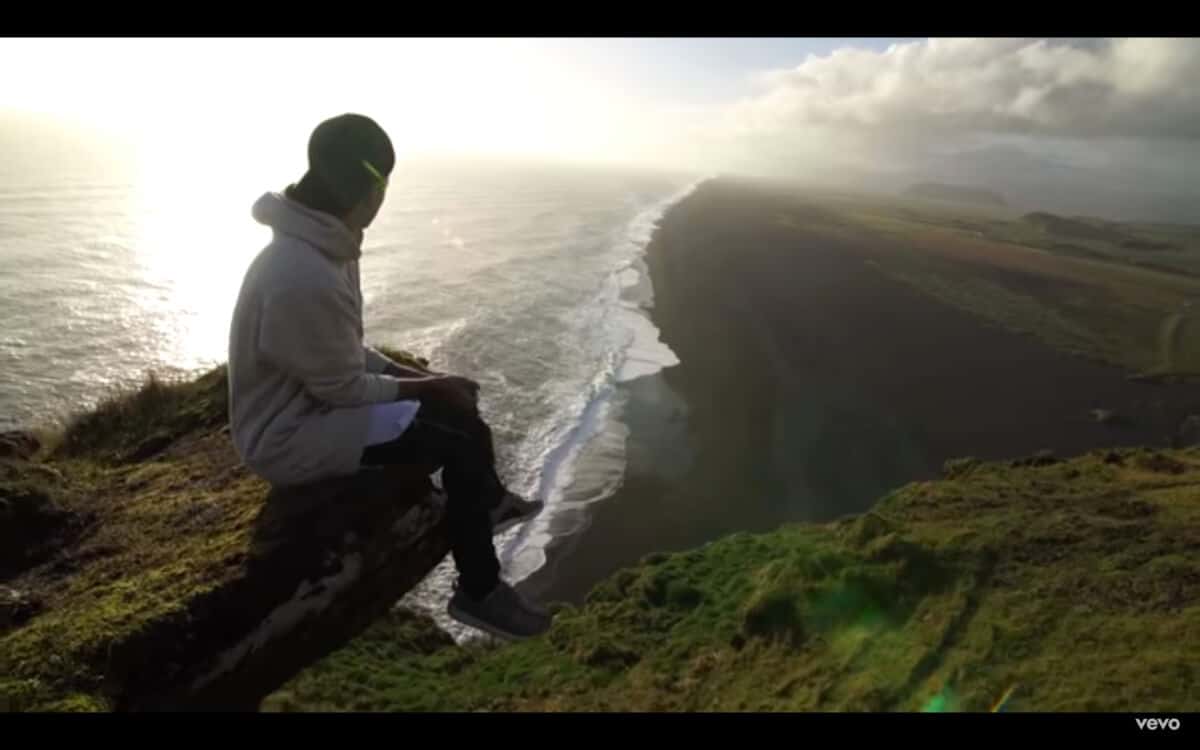 Justin Bieber sits on a cliff edge in Iceland for his video I'll Show You