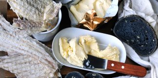 Table spread with Icelandic Hardfiskur and charcoal bread with butter