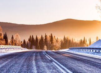 Things Tourists Should Watch Out For in Iceland Icy winter road with mountains in background