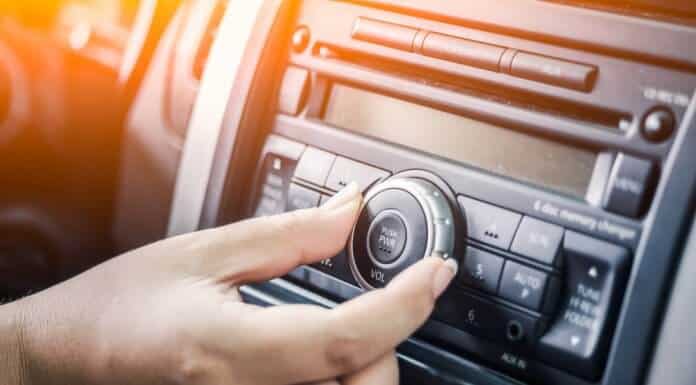 Woman turning up her playlist for best road trip songs