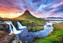 Kirkjufell mountain in Snaefellsnes peninsula with colorful sunset sky