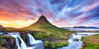 Kirkjufell mountain in Snaefellsnes peninsula with colorful sunset sky
