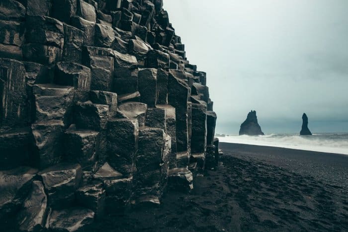 Reynisfjara peninsula and Vik's black sand beaches are popular attractions in South Iceland