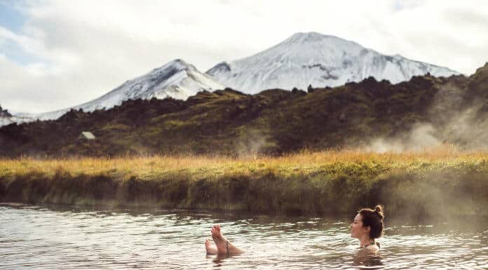 Woman soaking at an Icelandic geothermal hot pot