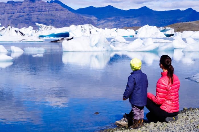 Mom and daugther enjoying view of Jökulsárlón glacier lagoon