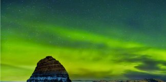 Iceland's Northern Lights over Kirkjufell mountain in winter