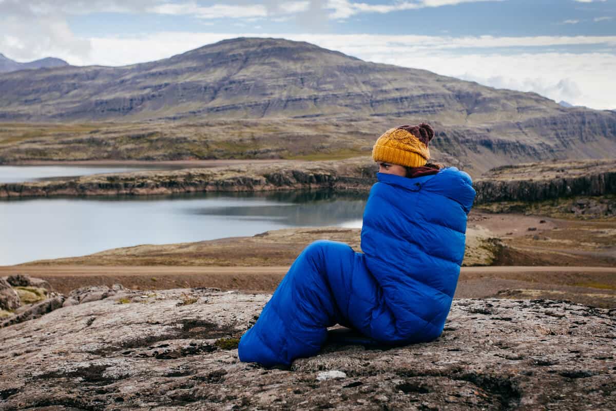 Iceland camping law girl in sleeping bag