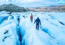 tourists hiking on a glacier in Iceland