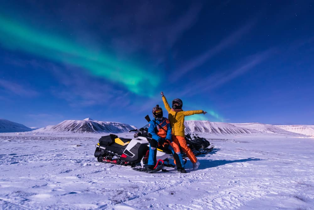 Visitors doing some snowmobiling on glaciers